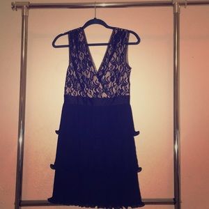 Black and nude lace dress with ruffles